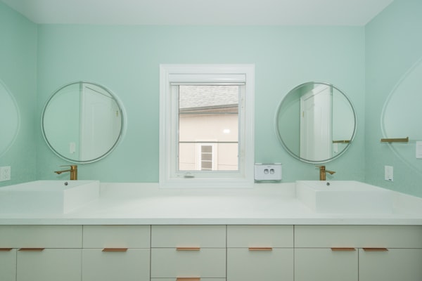 Modern bathroom vanity with professional plumbing installation